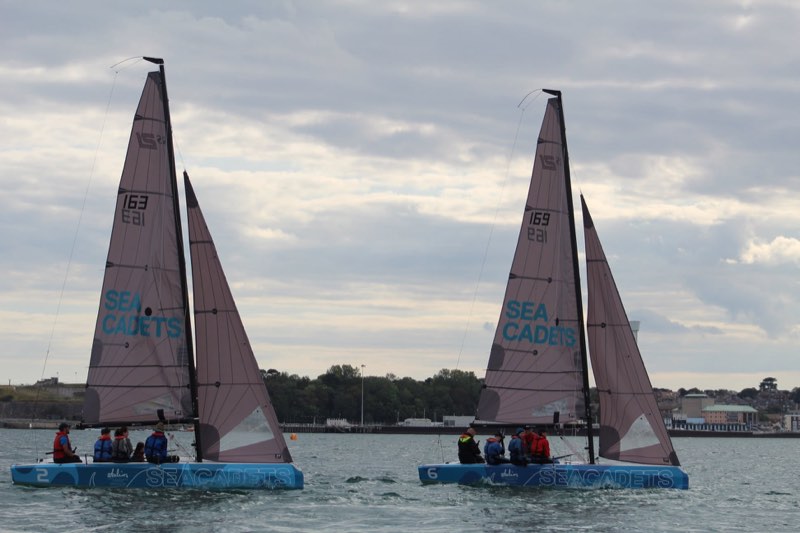 Our 163 and 169 sailing on parallel courses with the Weymouth harbour wall, the Pavilion and the town behind us.